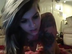 Tattooed hottie rides dildo on her pussy